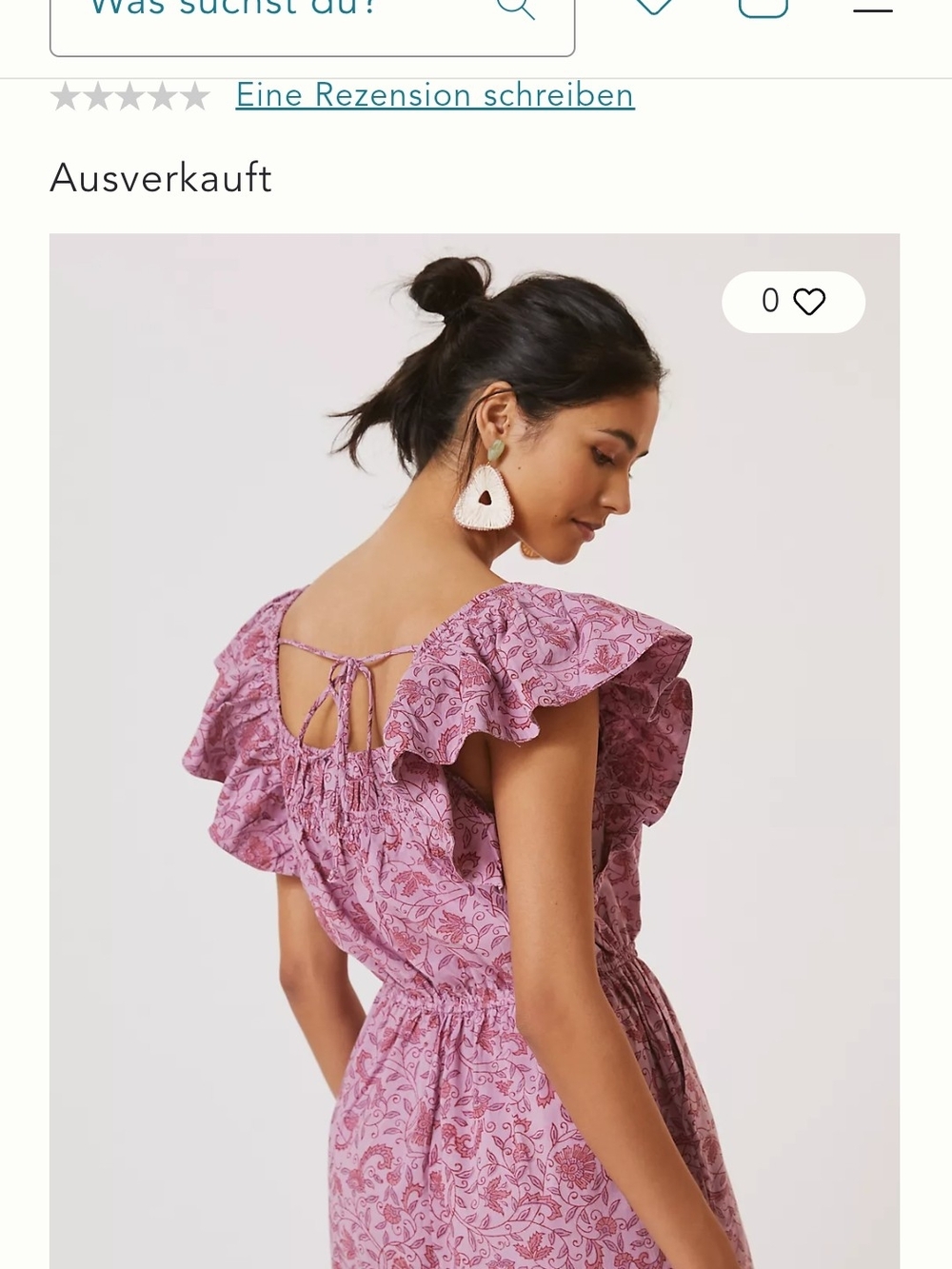 This is a mauve Kopal Myra Romper with a floral print and ruffled sleeves.